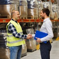 A supervisor recognizing an employee's good work in a warehouse