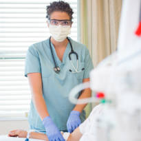 Healthcare worker with gloves and mask