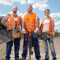 Three electrical workers with tools